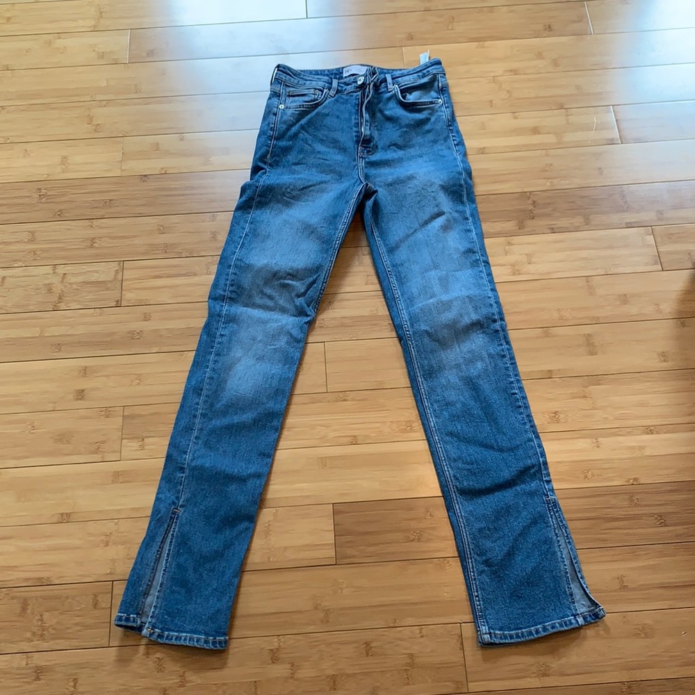 High waisted medium wash split leg jeans